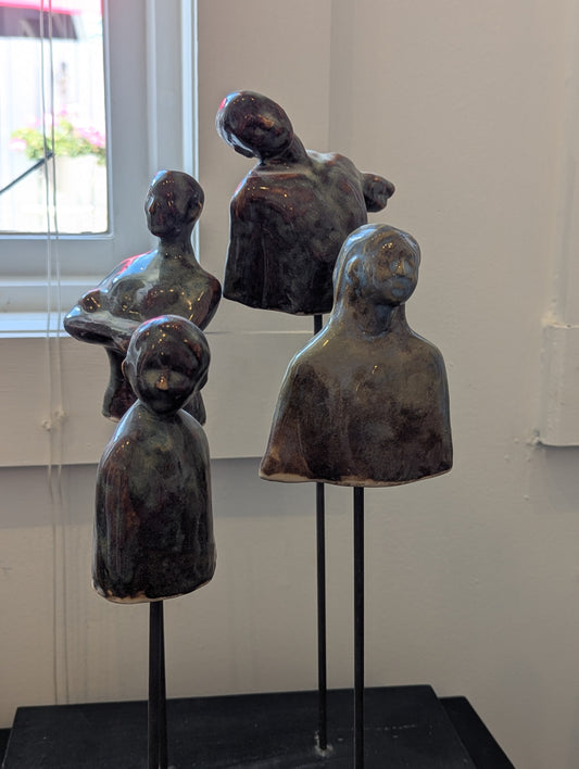 Family Affair: Four Partial Figures on a Base