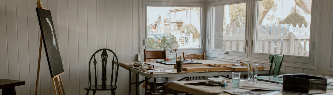 ECCO art studio interior with easel, worktables and natural light